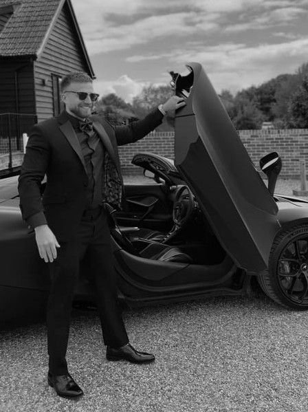 Snazzy photo, showing off the car the bride and groom are going to leave in